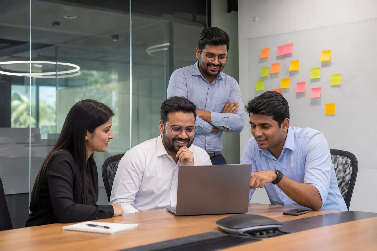 Sales team reviewing pipeline and deals in a meeting room